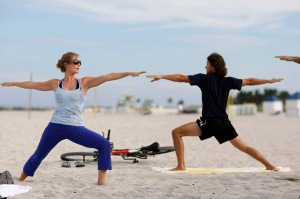 Floridians Relieve Stress With Yoga On The Beach